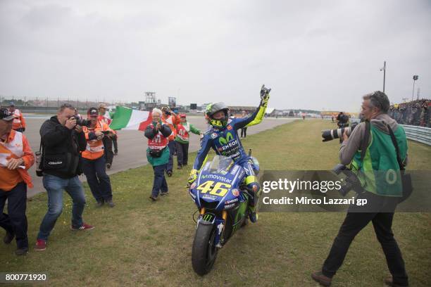 Valentino Rossi of Italy and Movistar Yamaha MotoGP celebrates the victory with fans at the end of the MotoGP Race during the MotoGP Netherlands -...