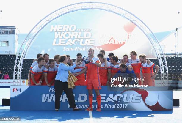 Billy Bakker of the Netherlands receives the trophy during the final match between Argentina and the Netherlands on day nine of the Hero Hockey World...