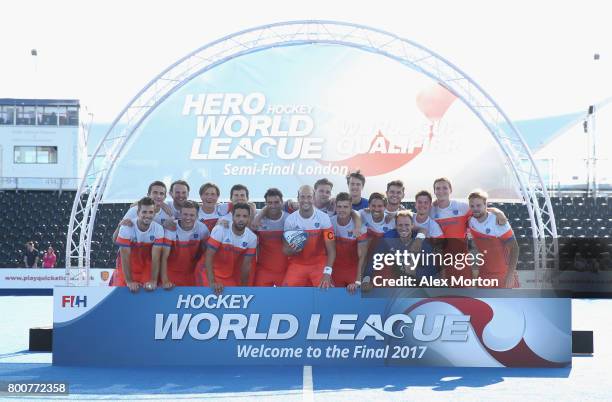 Netherlands players pose with the trophy after the final match between Argentina and the Netherlands on day nine of the Hero Hockey World League...