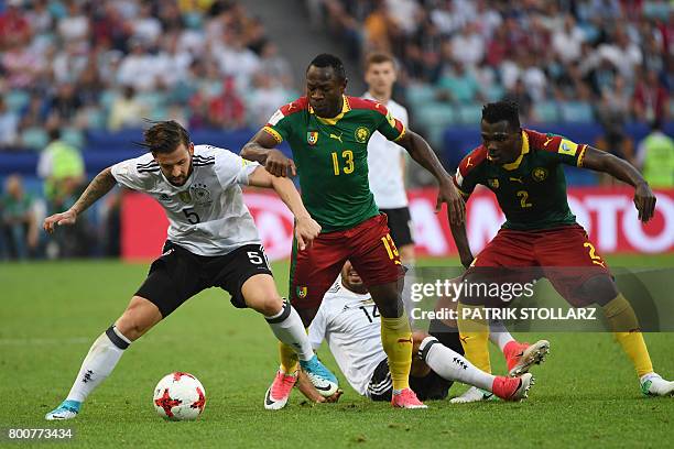 Germany's defender Marvin Plattenhardt challenges Cameroon's forward Christian Bassogog and Cameroon's defender Ernest Mabouka during the 2017 FIFA...