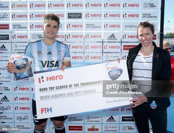 Gonzalo Peillat of Argentina is presented with his top scorer trophy and cheque after the final match between Argentina and the Netherlands on day...