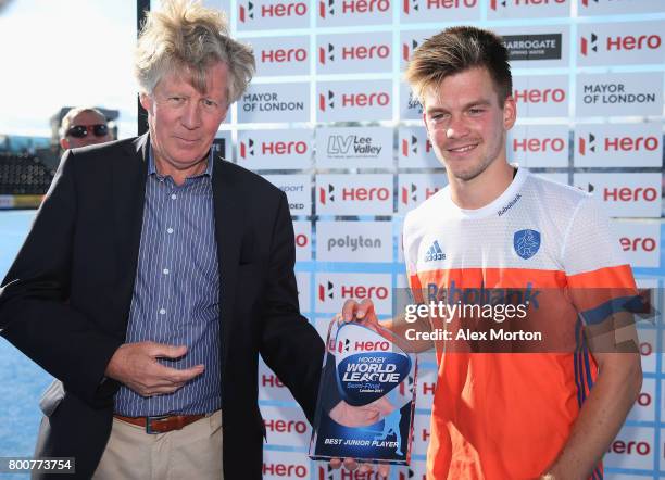 Thierry Brinkman of the Netherlands is presented with his Best Junior Player award after the final match between Argentina and the Netherlands on day...