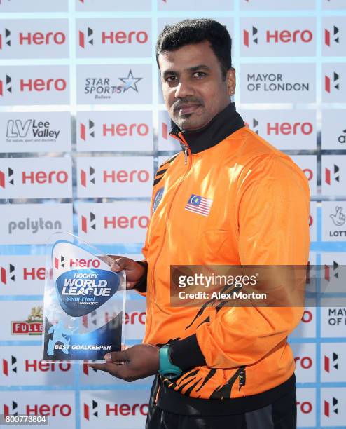 Kumar Subramiam of Malaysia poses with his Best Goalkeeper award after the final match between Argentina and the Netherlands on day nine of the Hero...