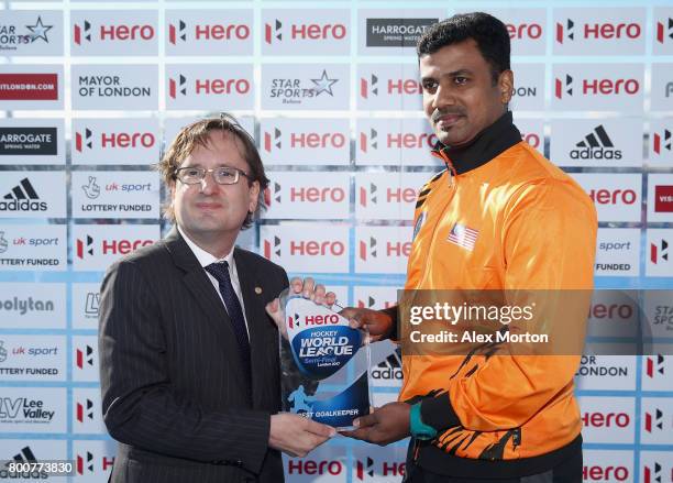 Kumar Subramiam of Malaysia is presented with his Best Goalkeeper award after the final match between Argentina and the Netherlands on day nine of...