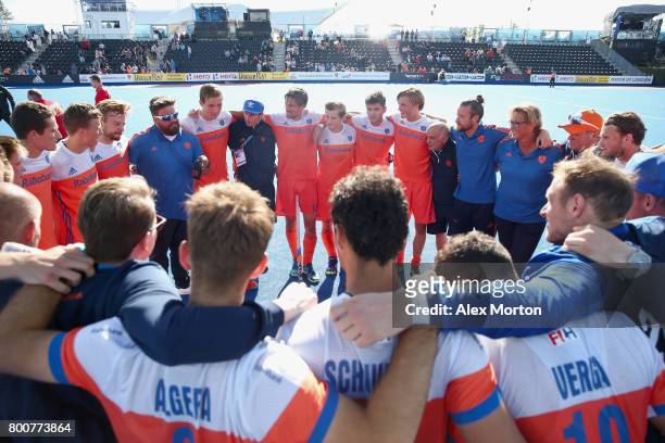 Netherlands players and staff huddle after the final match between Argentina and the Netherlands on day nine of the Hero Hockey World League...