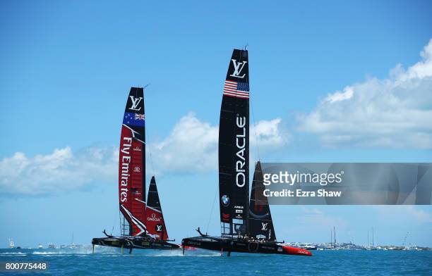 Emirates Team New Zealand helmed by Peter Burling competes with Oracle Team USA skippered by Jimmy Spithill on day 4 of the America's Cup Match...