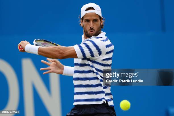 Feliciano Lopes of Spain hits a backhand during the Final match against Marin Cilic of Croatiaon day seven at Queens Club on June 25, 2017 in London,...