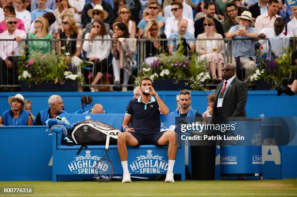 Marin Cilic of Croatia takes a drink of water during the Final match against Feliciano Lopes of Spain on day seven at Queens Club on June 25, 2017 in...