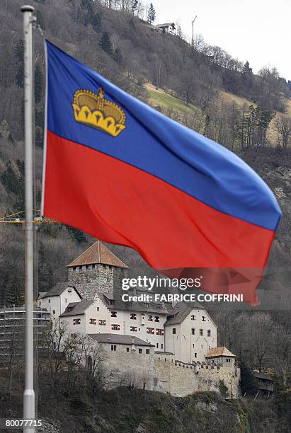 The Castel of Vaduz, home of the Liechtenstein princely family is pictured behind a Liechtenstein's flag on March 1, 2008 in Vaduz. Liechtenstein,...