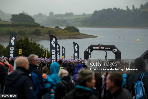 Athletes warm up and gather together behind the audience prior to start the swimming course of the Ironman 70.3 UK Exmoor at Wimbleball Lake on June...