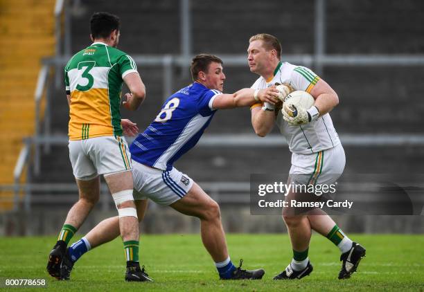 Offaly , Ireland - 25 June 2017; Alan Mulhall of Offaly is tackled by Liam Buchanan of Cavan during the GAA Football All-Ireland Senior Championship...