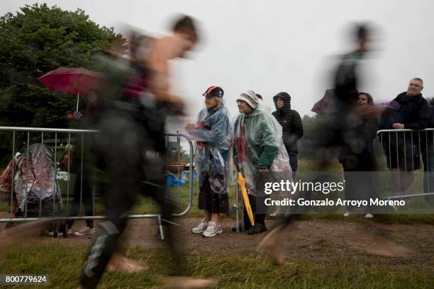 The crowd cheer athletes as they leave the water after the swimming course of the Ironman 70.3 UK Exmoor at Wimbleball Lake on June 25, 2017 in...