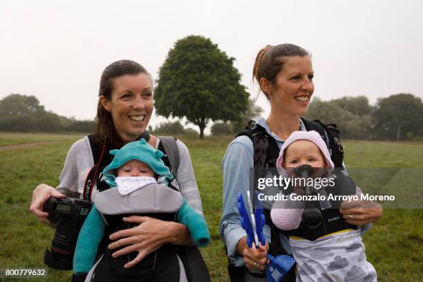 The crowd cheer athletes as they leave the water after the swimming course of the Ironman 70.3 UK Exmoor at Wimbleball Lake on June 25, 2017 in...