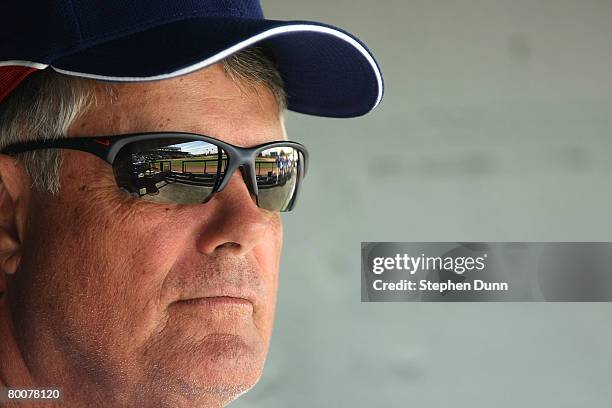 Manager Lou Piniella of the Chicago Cubs sits in the dugout before the game with the Los Angels of Anaheim on March 1, 2008 at Tempe Diablo Stadium...