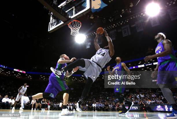 Ivan Johnson shoots against Jason Williams of the 3 Headed Monsters during week one of the BIG3 three on three basketball league at Barclays Center...