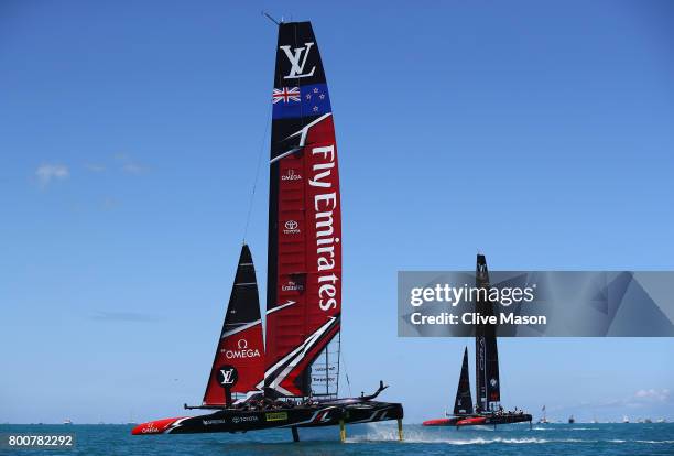 Emirates Team New Zealand helmed by Peter Burling competes with Oracle Team USA skippered by Jimmy Spithill on day 4 of the America's Cup Match...