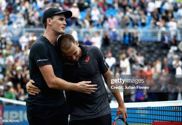 Jamie Murray of Great Britain and partner Bruno Soares of Brazil celebrate victory following the mens doubles final against Julien Benneteau of...
