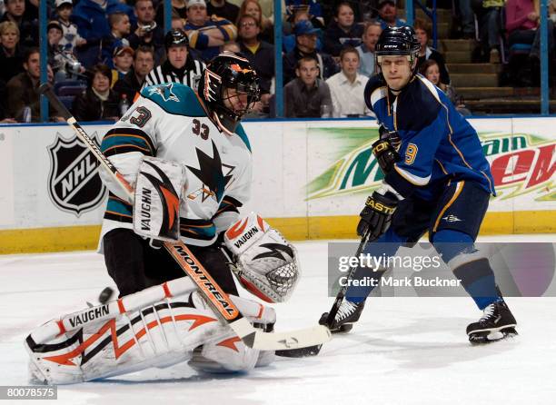 Brian Boucher of the San Jose Sharks deflects a shot from Paul Kariya of the St. Louis Blues on March 01, 2008 at Scottrade Center in St. Louis,...