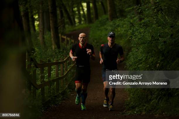 Athletes compete during the running course of the Ironman 70.3 UK Exmoor at Wimbleball Lake on June 25, 2017 in Somerset, United Kingdom.