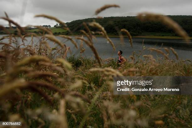 An athlete competes during the running course of the Ironman 70.3 UK Exmoor at Wimbleball Lake on June 25, 2017 in Somerset, United Kingdom.