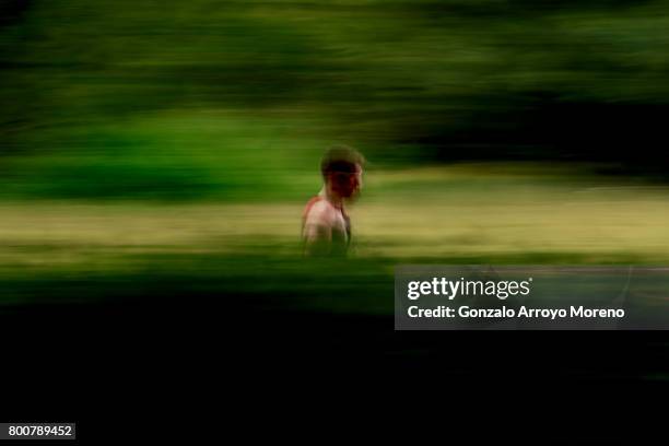 An athlete competes during the running course of the Ironman 70.3 UK Exmoor at Wimbleball Lake on June 25, 2017 in Somerset, United Kingdom.