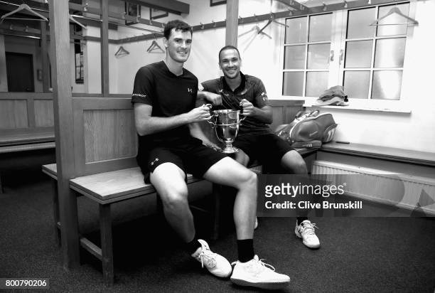 Jamie Murray of Great Britain and Bruno Soares of Brazil celebrate victory in the locker room following the mens doubles final against Julien...