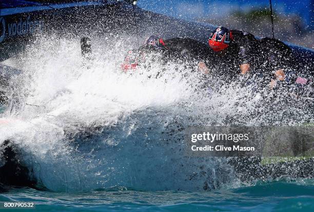 Emirates Team New Zealand helmed by Peter Burling cross the finish line and win race 8 on day 4 of the America's Cup Match Presented by Louis Vuitton...