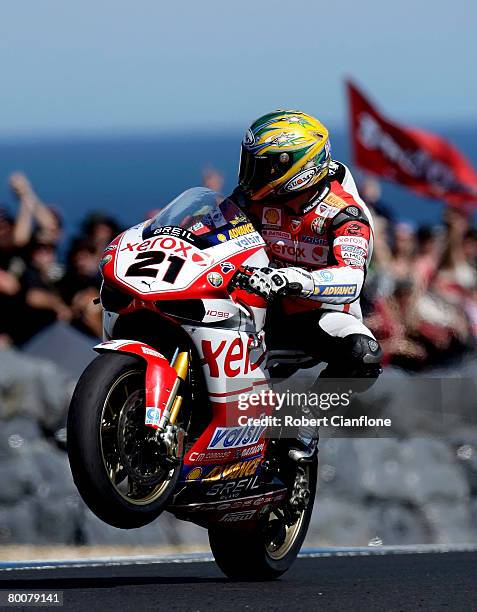 Troy Bayliss of Australia and the Ducati Xerox Team celebrates his win in race two of round two of the Superbike World Championship at the Phillip...