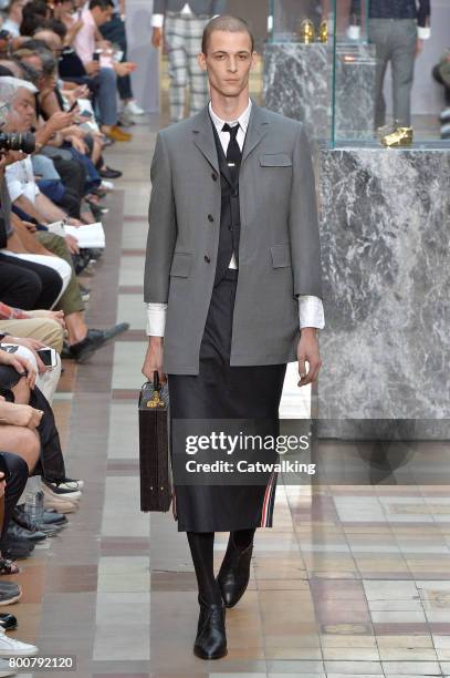 Model walks the runway at the Thom Browne Spring Summer 2018 fashion show during Paris Menswear Fashion Week on June 25, 2017 in Paris, France.