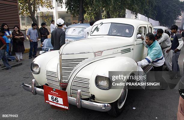 Onlookers push a 1939's Dodge vintage car owned by the Automotive Heritage trust after the flag off of ' the 42nd Statesman Vintage & Classic Car...