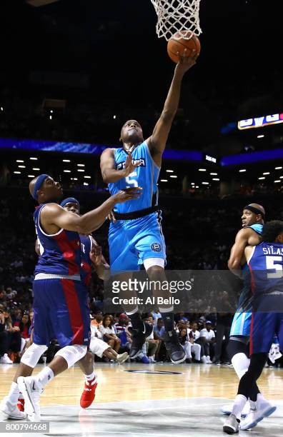 Cuttino Mobley of Power drives to the basket against Bonzi Wells of Tri-State during week one of the BIG3 three on three basketball league at...