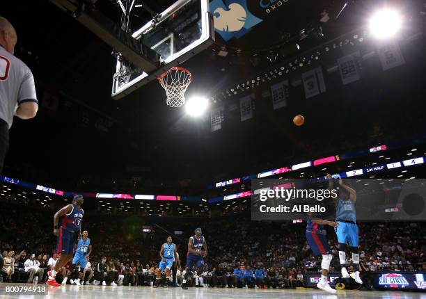 Jerome Williams of Power shoots against Bonzi Wells of Tri-State during week one of the BIG3 three on three basketball league at Barclays Center on...