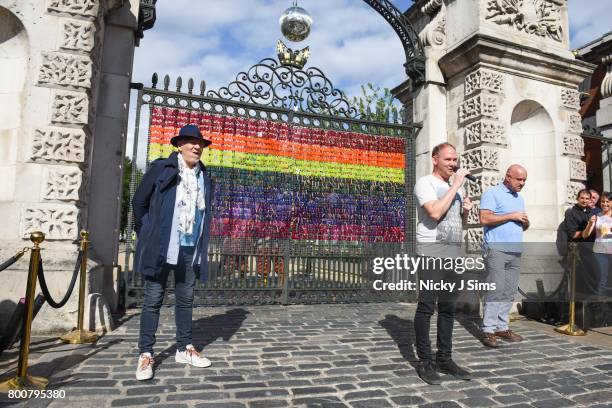 Ian McKellen is introduced by Deputy Leader of the Council Danny Thorpe before he unveils a rainbow coloured love locks display on West gates at the...