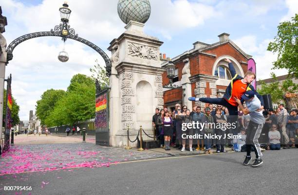 Dancers perform a preview of a future festival performance after Ian McKellen unveiled a rainbow coloured love locks display on West gates at the Old...