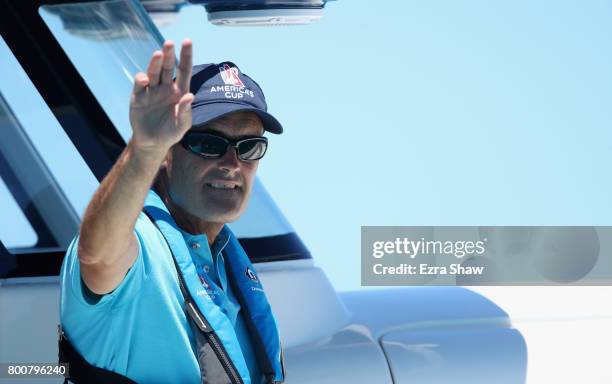 Sir Russell Coutts, CEO of the America's Cup Event Authority, waves before ORACLE TEAM USA raced against Emirates Team New Zealand on day 4 of the...