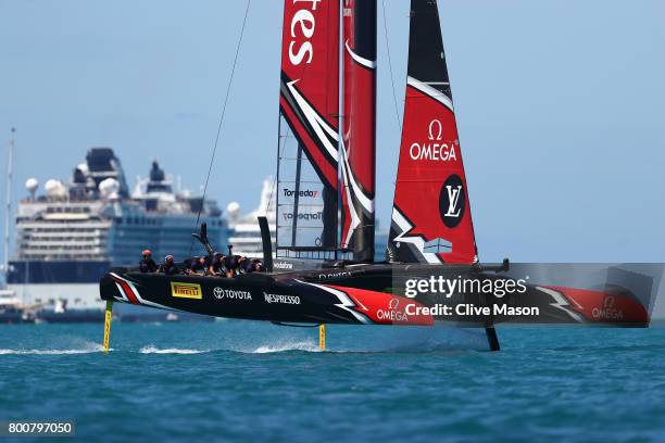 Emirates Team New Zealand helmed by Peter Burling in action racing on day 4 of the America's Cup Match Presented by Louis Vuitton on June 25, 2017 in...