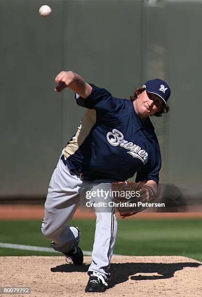 Relief pitcher Derrick Turnbow of the Milwaukee Brewers warms up in the bull pen during the spring training game against the Oakland Athletics at...
