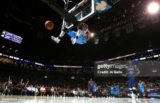 Jerome Williams of Power dunks against Tri-State during week one of the BIG3 three on three basketball league at Barclays Center on June 25, 2017 in...