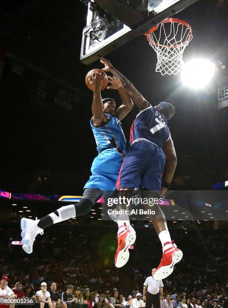 Jerome Williams of Power drives to the basket against Jermaine O'Neal of Tri-State during week one of the BIG3 three on three basketball league at...