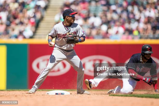 Minnesota Twins shortstop Jorge Polanco holds the ball after forcing out Cleveland Indians first baseman Carlos Santana at second base during the...