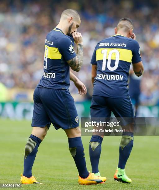 Dario Benedetto of Boca Juniors celebrates with teammate Ricardo Centurion after scoring the first goal of his team during a match between Boca...