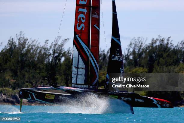 Emirates Team New Zealand helmed by Peter Burling in action racing on day 4 of the America's Cup Match Presented by Louis Vuitton on June 25, 2017 in...