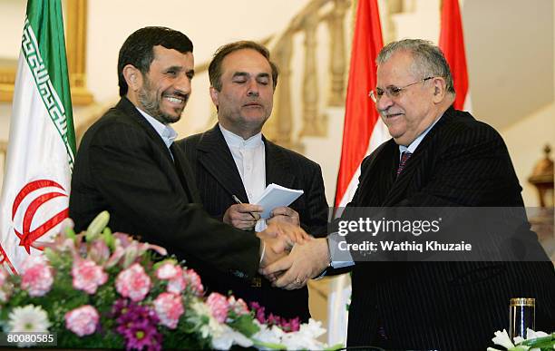 Iraqi President Jalal Talabani shakes hands with Iranian President Mahmoud Ahmadinejad on March 2, 2008 at the Talabani residence in Baghdad, Iraq....