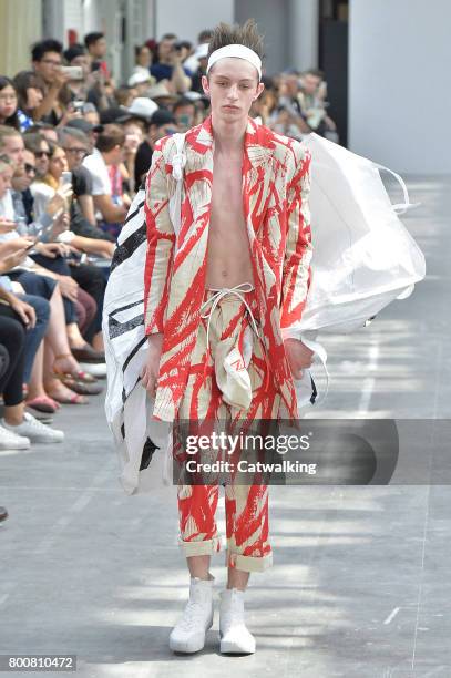 Model walks the runway at the Sankuanz Spring Summer 2018 fashion show during Paris Menswear Fashion Week on June 25, 2017 in Paris, France.