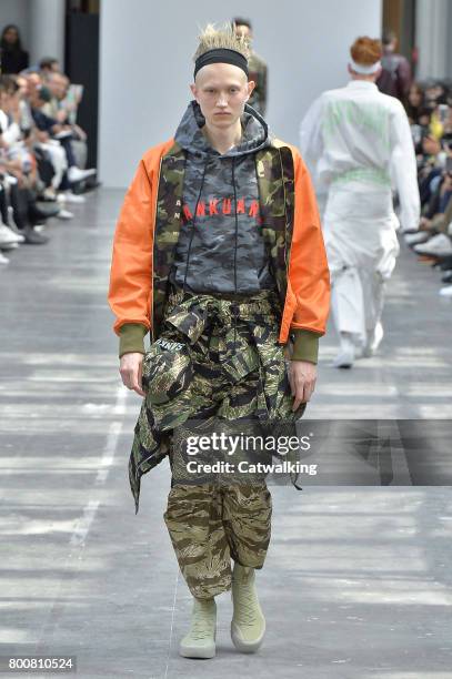 Model walks the runway at the Sankuanz Spring Summer 2018 fashion show during Paris Menswear Fashion Week on June 25, 2017 in Paris, France.