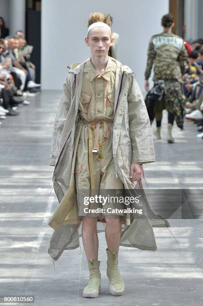 Model walks the runway at the Sankuanz Spring Summer 2018 fashion show during Paris Menswear Fashion Week on June 25, 2017 in Paris, France.