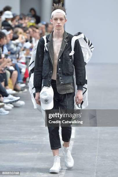 Model walks the runway at the Sankuanz Spring Summer 2018 fashion show during Paris Menswear Fashion Week on June 25, 2017 in Paris, France.