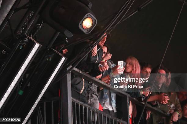 David and Victoria Beckham at the side of stage during Ed Sheeran as he performs on the Pyramid stage on day 4 of the Glastonbury Festival 2017 at...