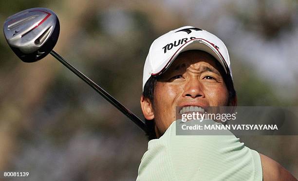 Japanese golfer Taichiro Kiyoto tees off on the eighteenth hole during the final round of the Johnnie Walker Classic 2008 in Gurgaon on the outskirts...