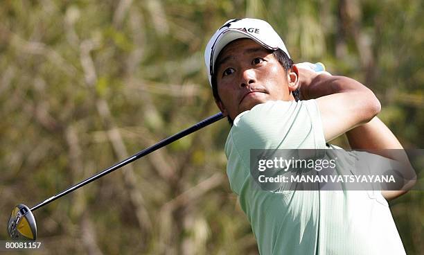 Japanese golfer Taichiro Kiyoto tees off on the ninth hole during the final round of the Johnnie Walker Classic 2008 in Gurgaon on the outskirts of...